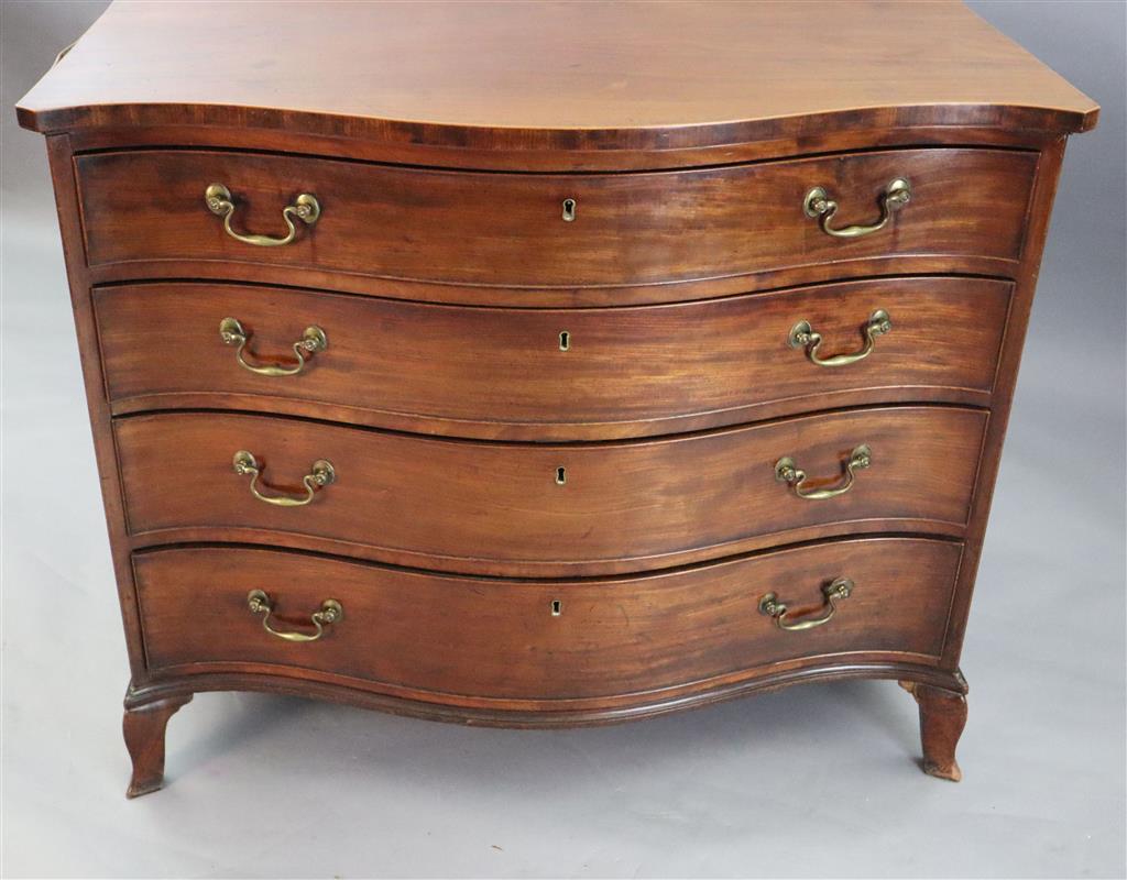 A George III serpentine mahogany dressing chest, W.3ft 6in. D.2ft 1in. H.2ft 10in.